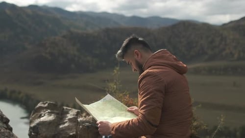 Hiker Tourist Traveler Man with Map Mountain Camping Camp Tent Traveling Hiking Landscape Nature