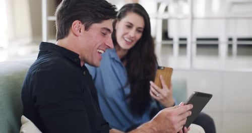 Smiling Couple Video Chats at Home on Tablet