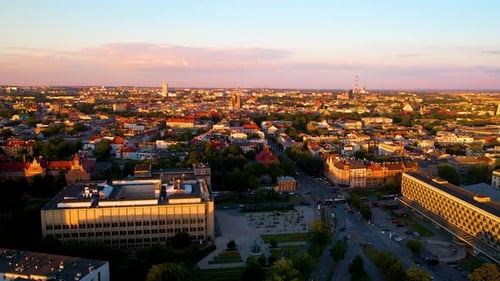 Krakow City Poland at Sunset, Panoramic Cityscape Aerial View of Urban Streets and Buildings in Down