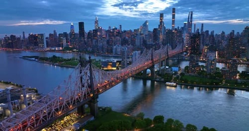 New York in lights at evening time. Beautiful Queensboro Bridge