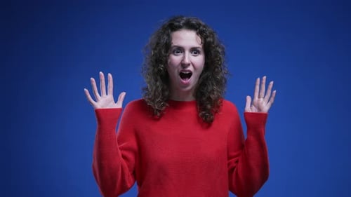 Woman Reacts to News with Happy Surprise