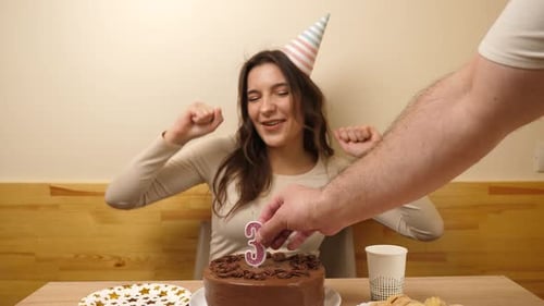 Excited Woman Celebrating Birthday with Chocolate Cake