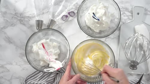Step By Step Flat Lay Mixing Food Coloring Into the Meringue to Bake Unicorn Meringue Cookies
