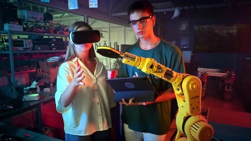 Young Adults Working with VR and Robotics