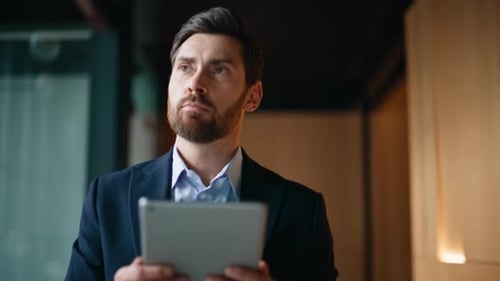 Elegant Employee Looking Tablet Walking Office Corridor Closeup Confident Man