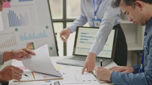 Close up of business hands are working and brainstorming on paperworks.