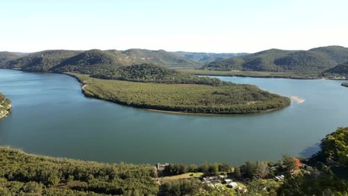 Hawkesbury River Australia. The drone flies backwards away from this amazing river vista into the su