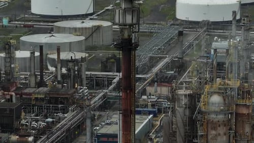 Ascending aerial of flame exhaust at oil refinery_1