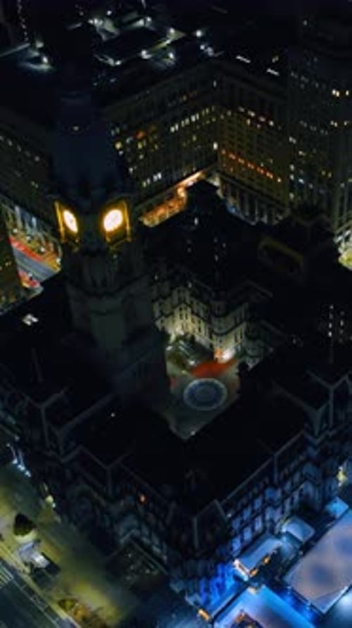 The clock is lit on the tower of gorgeous Philadelphia City Hall at night.