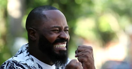 Bearded Man Celebrating With Fists Pumped