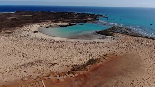 Aerial shot of La Concha beach on Lobos Island. Turquoise beach. It belongs to the Canary Islands an
