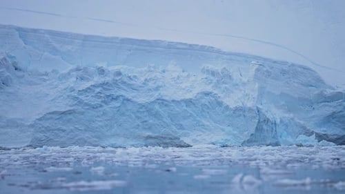 Blue Glacier Ice Close Up Detail, Antarctica Landscape Scenery with Sea Ice and Ocean in Beautiful A