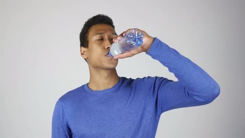 African Man Drinking Water
