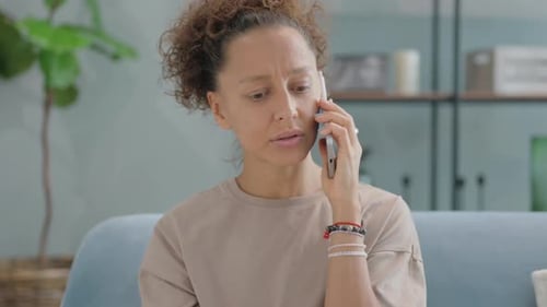 Woman Talking on Cell Phone Indoors