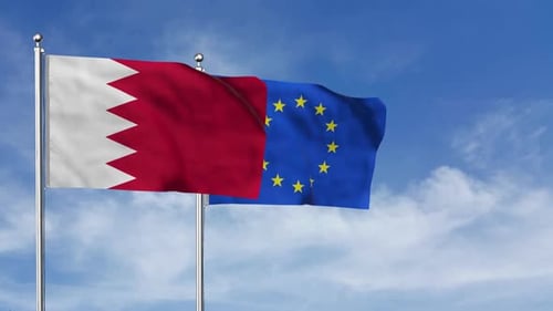 Bahrain and European Union Flags Waving Against Blue Sky