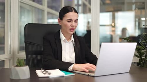 Female Office Worker Typing on Modern Laptop Keyboard and Feeling Headache