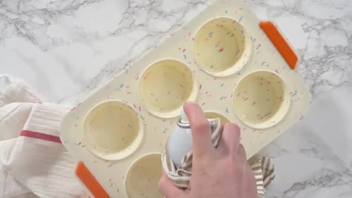 Spraying Baking Pan and Adding Bacon Pieces