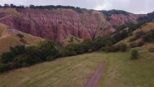 Aerial view Panorama of picturesque canyon with red sandstone rocks in light cloudy day. Popular tou
