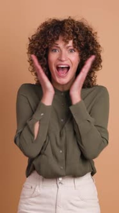 Woman Reacts to Good News with Joy