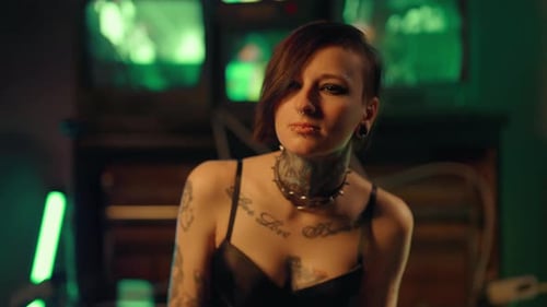 Sexy Lady Looking at Camera and Posing in Studio Tattoos on Female Body Beautiful Young Woman in