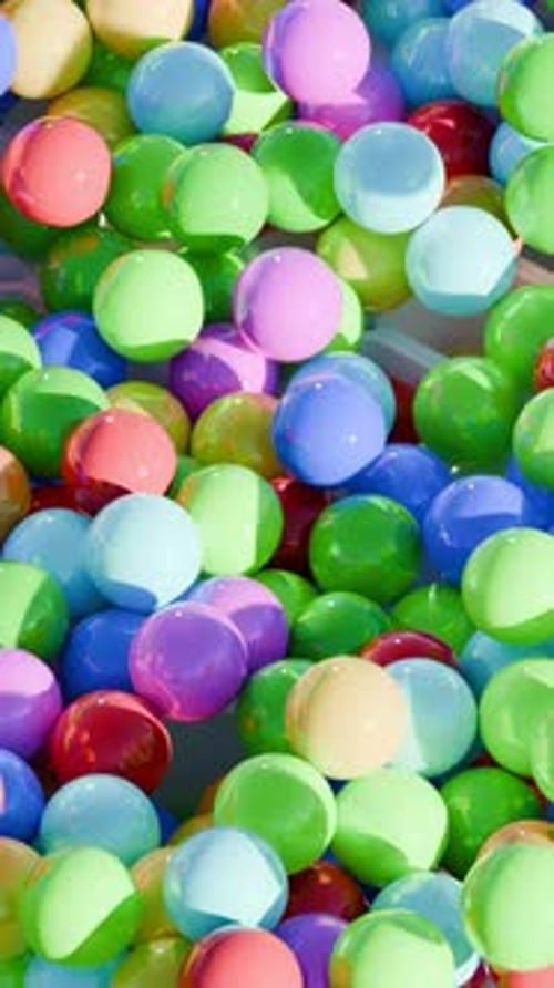 Falling Colorful Spheres Filling a White Geometric Grid