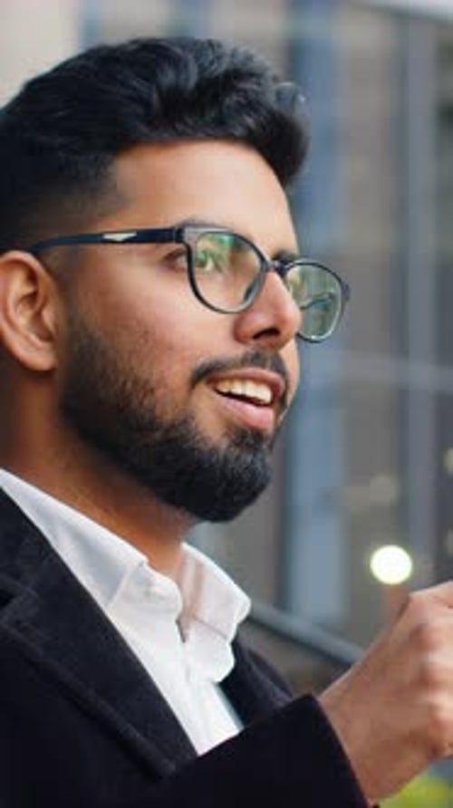 Happy Indian Business Man Enjoying Morning Coffee Hot Drink Relaxing Taking a Break in Downtown City
