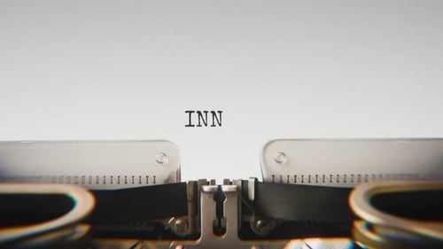 Old mechanical typewriter typing Innocence in a close-up view.
