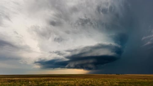 Dramatic clouds over field time lapse