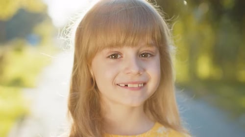 Portrait of Happy Preteen Child Girl Face Smiling Looking at Camera Good Mood Satisfied on Park