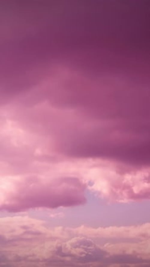 Beautiful Pink and Purple Clouds Drifting in Sky