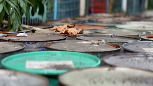 Industry oil barrels or chemical drums stacked outdoors