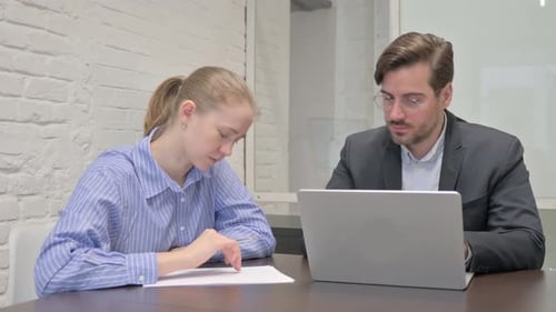 Business People Discussing Project in Office