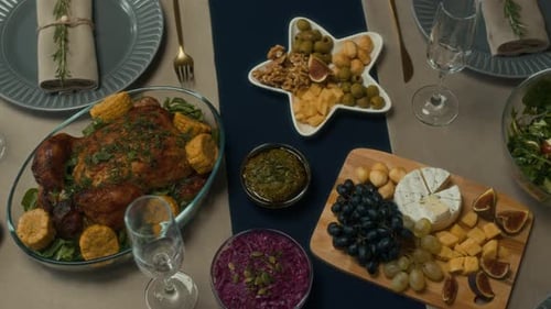 Top View of Festive Dinner Table with Roast and Appetizers for Christmas