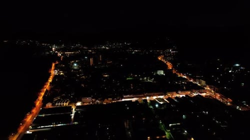 Top View of the Night City and Illuminated Road
