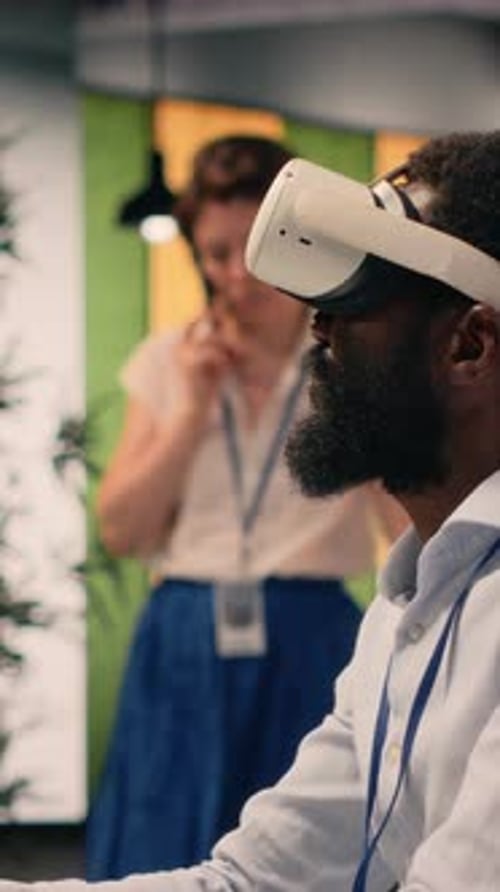 Vertical Video Black Professional Using VR Glasses in Corporate Office Environment