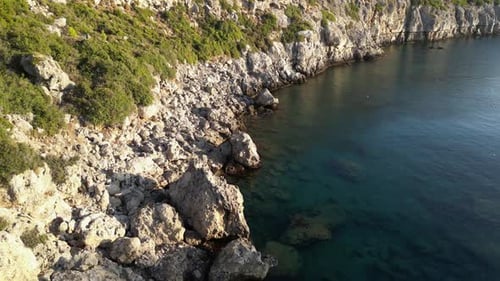 Scenic Rocky Coastline Meeting Clear Turquoise Ocean Waters