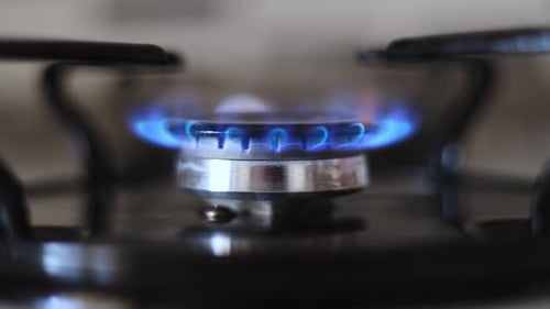Gas Stove is Set on Fire a Blue Fire is Ignited High Payments for Natural Gas Import and Export of