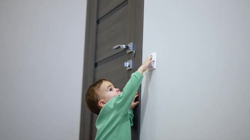 Infant Flips Light Switch in Dark Room