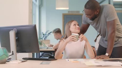 Colleagues Sharing Coffee and Conversation at the Office