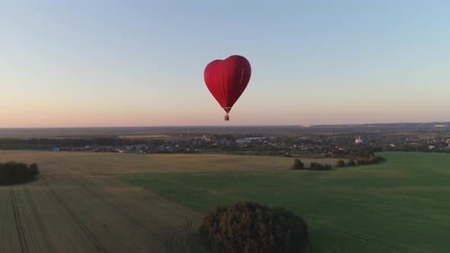 Aerial View of Heart Shaped Hot Air Balloon at Sunset