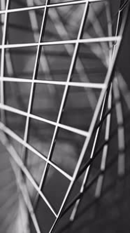 Seamless 3D loop showing a rotating Mobius band made of polished chrome mesh.