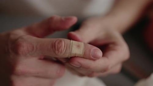 Applying Bandage on Finger Close Up First Aid