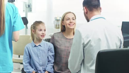 Family at Doctor's Office Getting Medical Advice