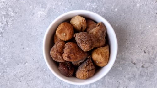 Dried fig are a sweet, healthy fruit for vegans and vegetarians. Dried fig as a food background