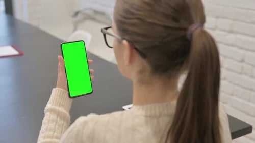 Woman Using Phone with Green Chroma Key Screen