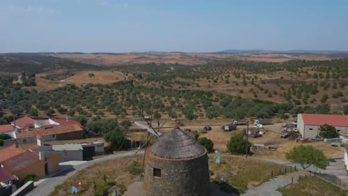 Scenic aerial view of old windmill in rural setting