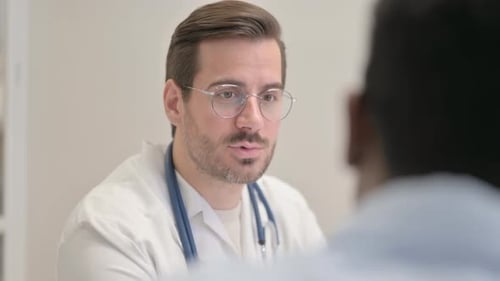 Close up of Doctor Talking with Patient in Clinic