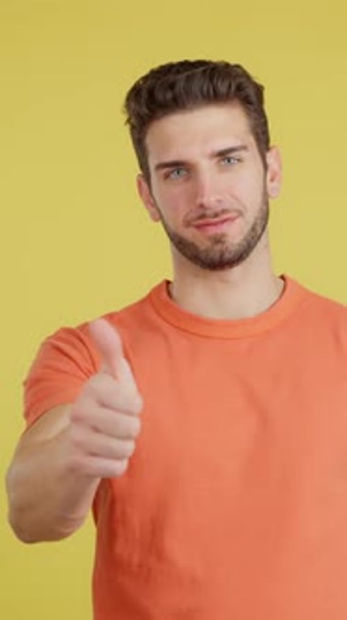 Happy Caucasian Man Gesturing Agreement Raising a Thumb Up