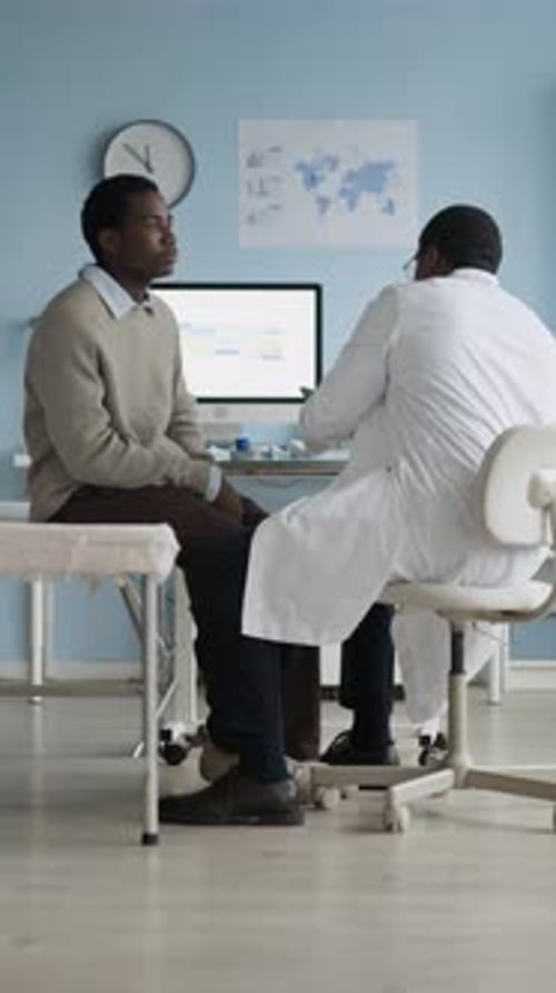 Doctor Examining Patient Thyroid Gland