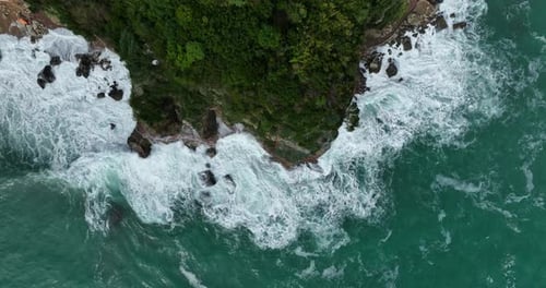 Overhead View Of Sea Waves Crashing On The Rocky Coastline And Cliffs In Budva, Montenegro. - aerial
